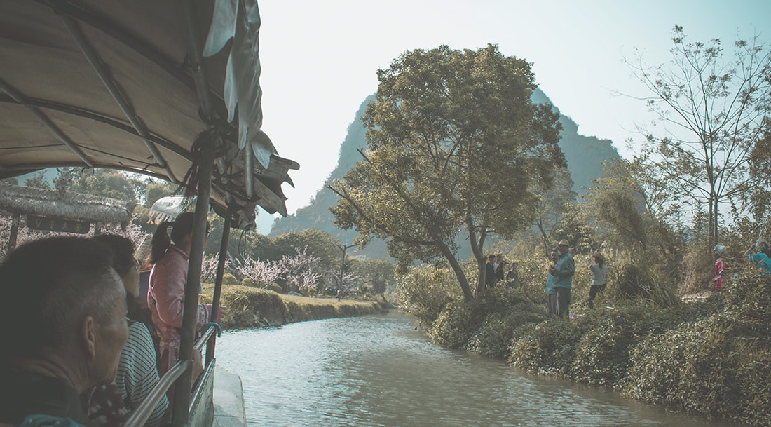 Tour boats offer cruises on the Li River past picturesque countryside from the town of Guilin to the north.