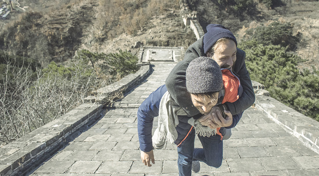 One Davide carrying the other Davide up the Great Wall of China.